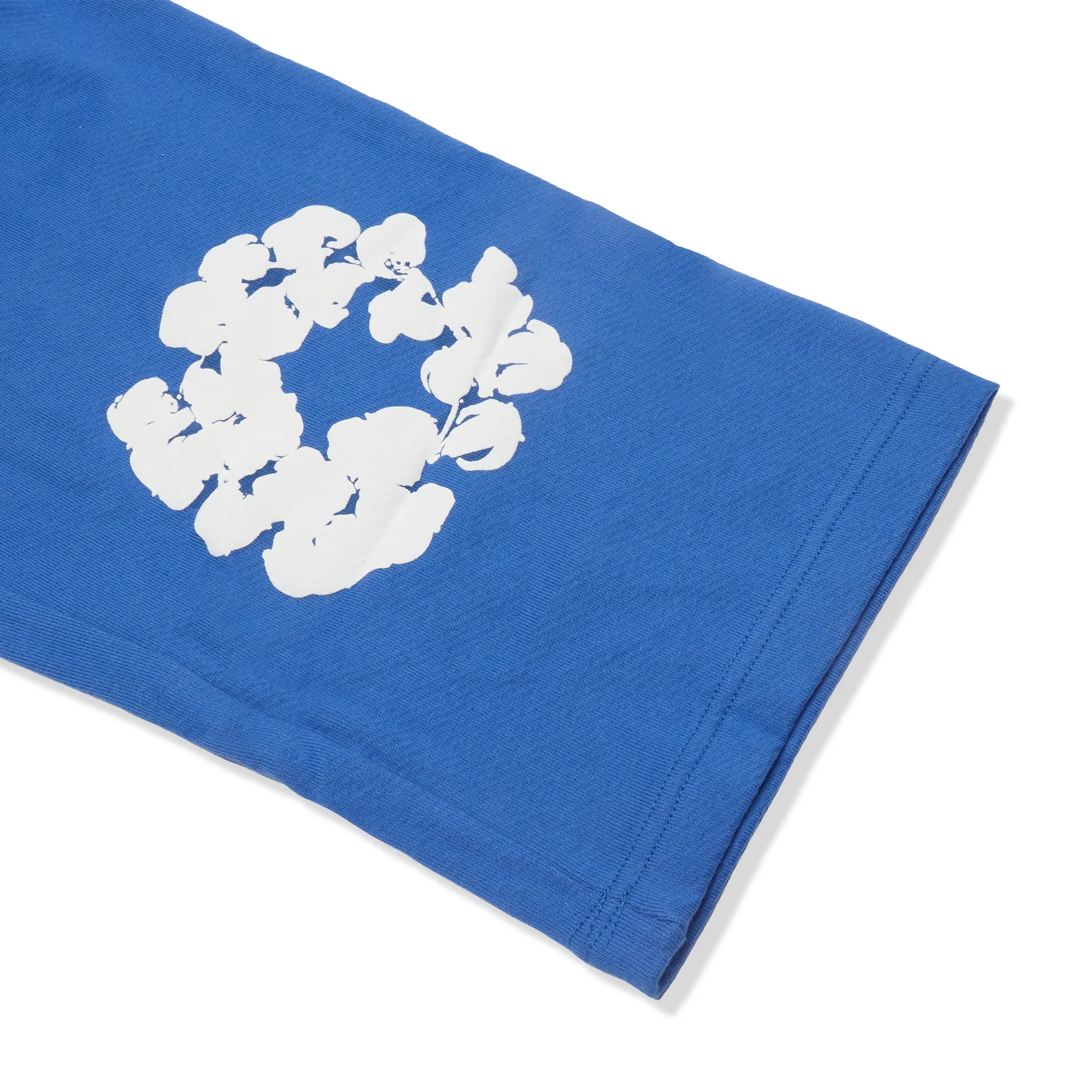 Detailed Lower View of Denim Tears The Cotton Wreath Baggy Blue Sweatpants SS25BAS11402051
